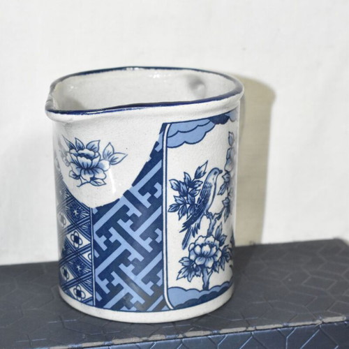 Vintage ceramic jug blue and white with bird and floral motifs used