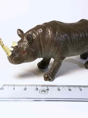 Rhinoceros plastic toy used with scratches and marks