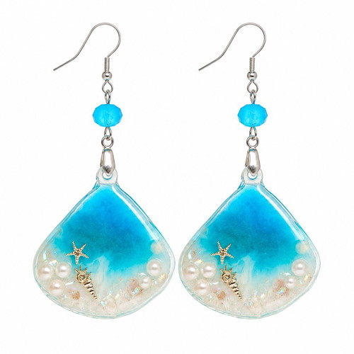 Handmade earrings with stars, shells, pearls, and crystals in resin