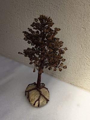 Handmade decorative tree with copper wire and beads on stone base