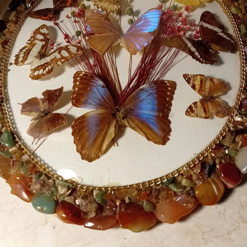Vintage framed art with colorful stones and butterflies