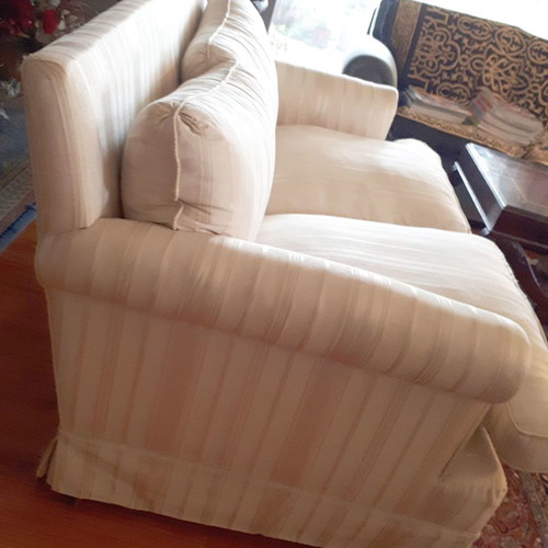 Two-seater sofa used 1.40x0.85 m with silk-cotton filling