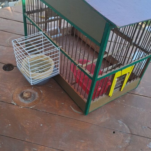 Handmade birdcage with feeder, waterer, nest, and egg holder