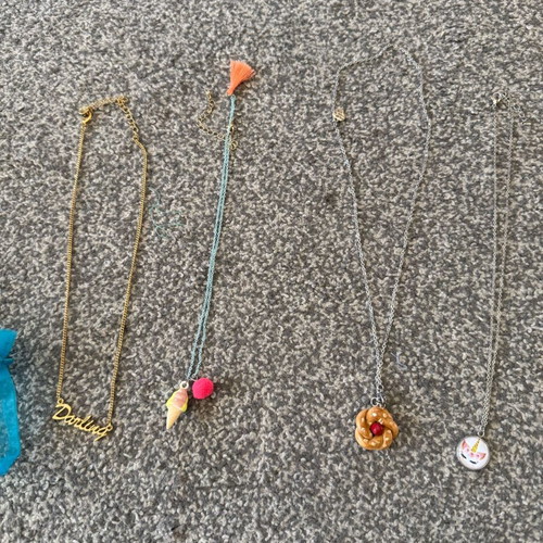 Children's jewelry used, colorful bracelets and pendants