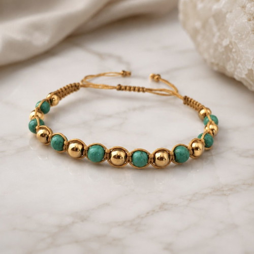 Handmade macrame bracelet with green and gold beads, adjustable