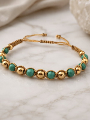 Handmade macrame bracelet with green and gold beads, adjustable