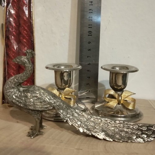 Silver-plated candlesticks with candles and peacock figurine like new