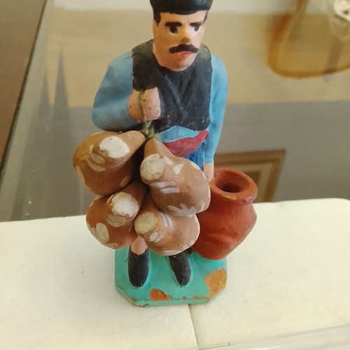 Traditional handmade clay figurine of a villager used