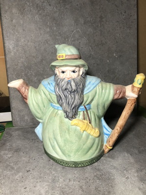 Vintage ceramic teapot shaped like a wizard