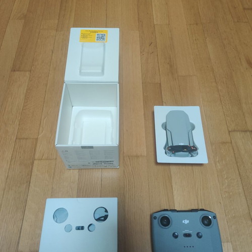 DJI Mini 4K drone with controller and box