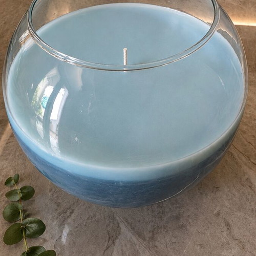 Large blue scented candle in glass