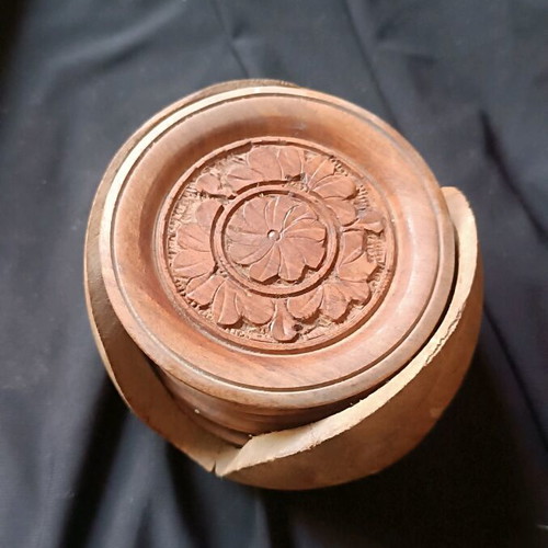 Wooden vintage hand-carved coasters used