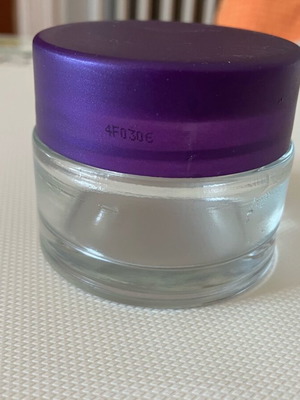 Empty 50 ml container made of thick glass, like new