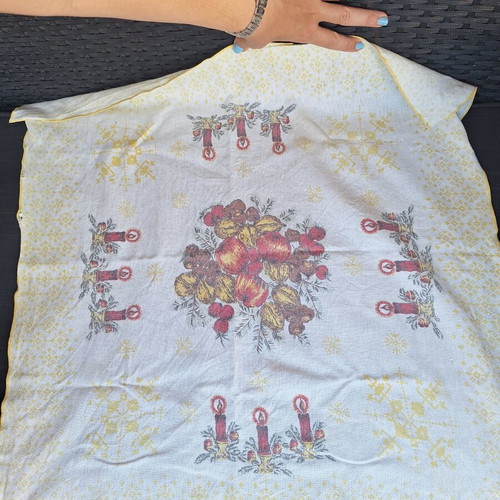 Small tablecloth with candles and fruit used
