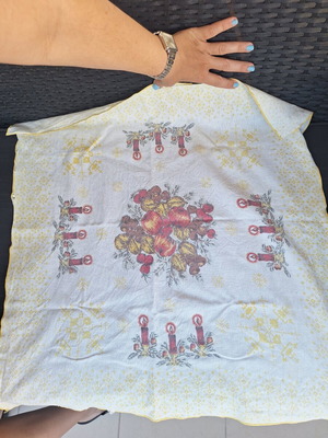 Small tablecloth with candles and fruit used