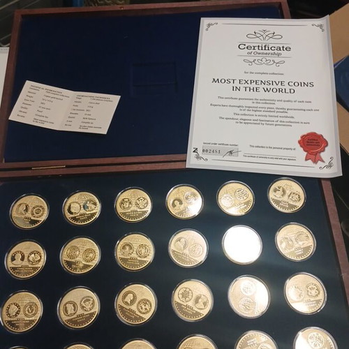 Gold-plated commemorative medals set like new in wooden case with certificates