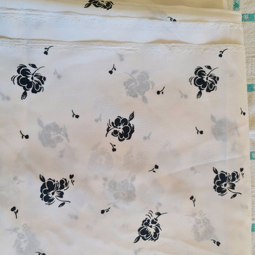 White fabric with black flowers for dress