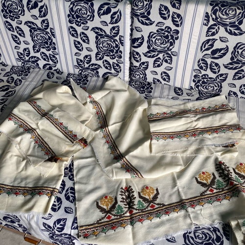 Woven fabric on loom new, thin cream wool textile with embroidery