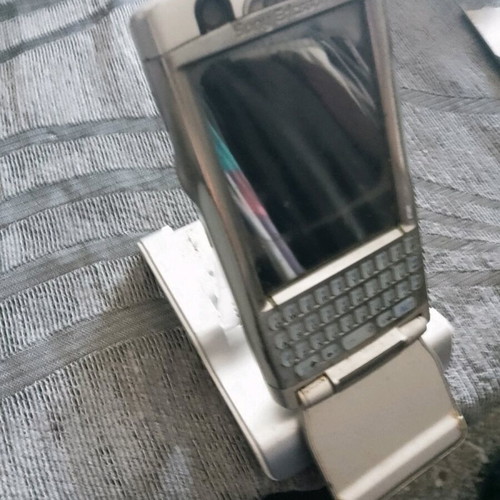 Sony Ericsson P 990i vintage mobile phone used with dock and charger