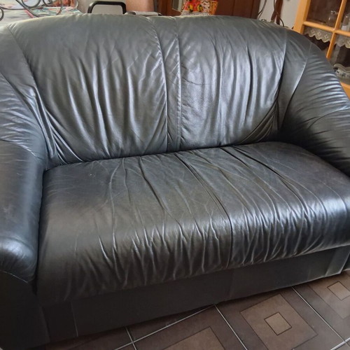 Black two-seater leather sofa used, soft genuine leather