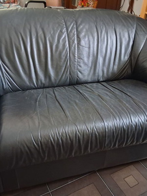 Black two-seater leather sofa used, soft genuine leather