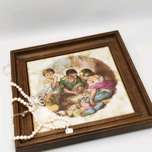 Vintage ceramic picture used with wooden frame