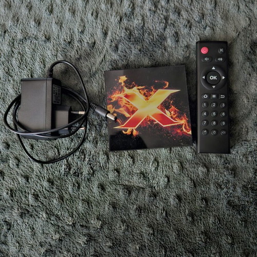 Vontar X1 Smart TV Box used with remote and power adapter