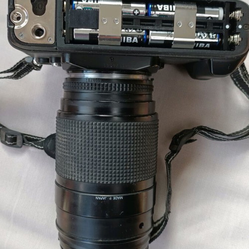Nikon F301 camera used with 35-135 lens and flash