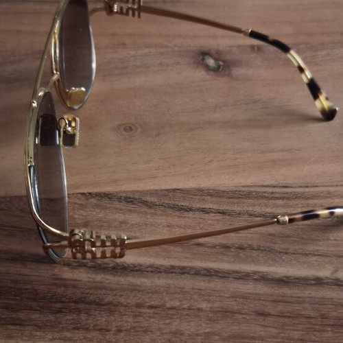 Miu Miu sunglasses like new, gold color