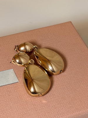 Women's gold-colored earrings used with minor wear