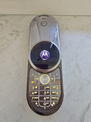 Motorola Aura R1 used, gray phone with smooth mechanism