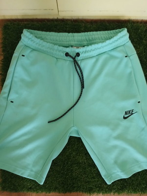 Nike shorts, turquoise and black, size M