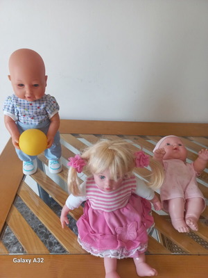3 children's dolls