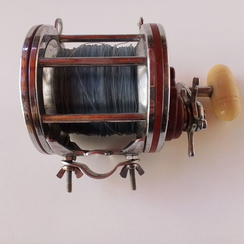 Penn Senator 114H fishing reel with large set of unused artificial lures and soft baits