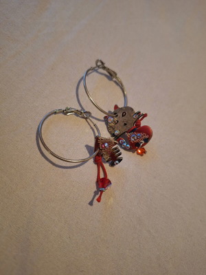 Silver hoop earrings with cat and fishbone charms used, red details and rhinestones