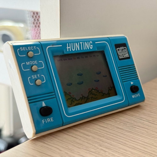 Mini retro arcade handheld console used without cover