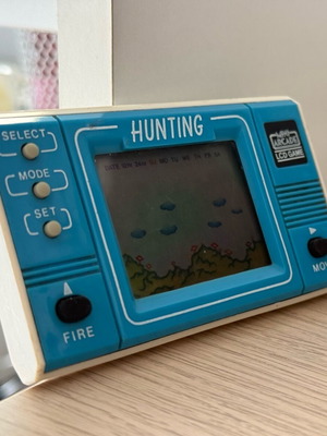 Mini retro arcade handheld console used without cover