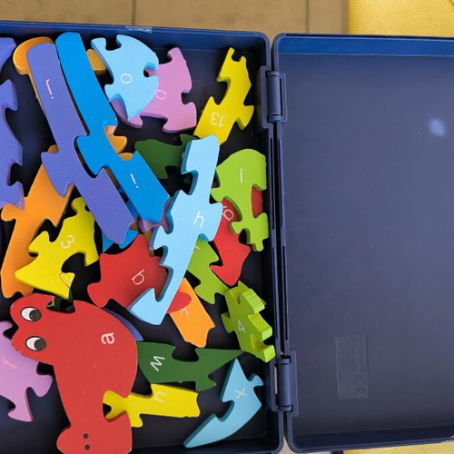 Wooden puzzle construction with letters and numbers