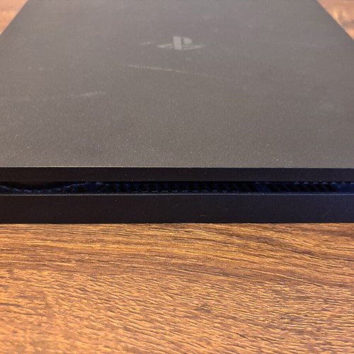 Sony PlayStation 4 Slim 500GB console with controllers