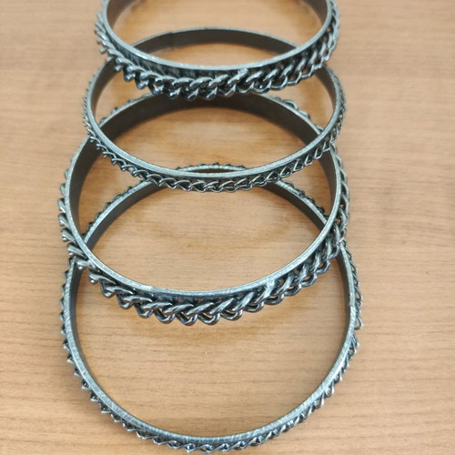 Stacking bangle bracelets used, 7 black metal and 2 colored