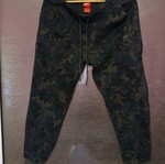 Nike Tech Fleece pants, size M, black and green