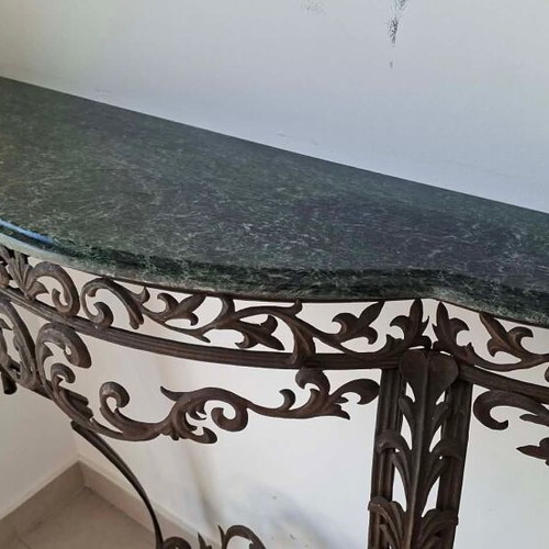 Metal console used with marble top and ornate wrought iron design