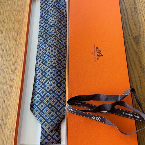Hermes silk tie new with dark blue background