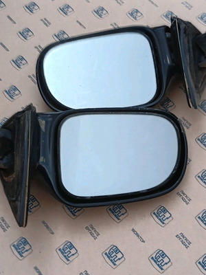 Suzuki Swift 92 electric mirrors used, black plastic