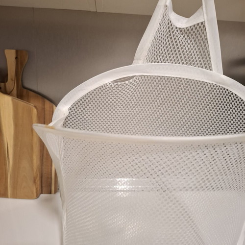 Foldable mesh storage basket white used for laundry and toys