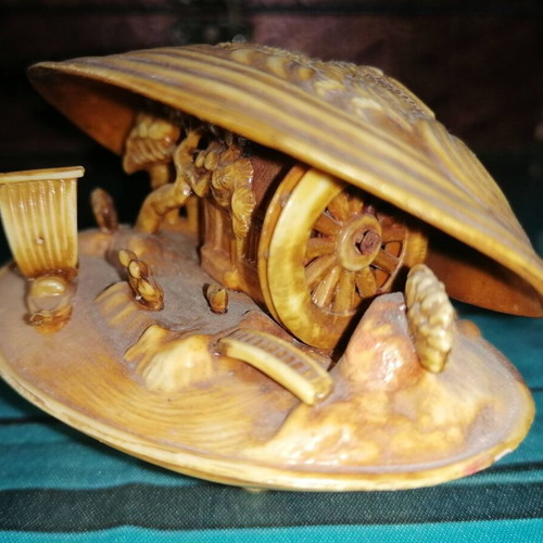 Vintage carved shell with dragon and scenic details
