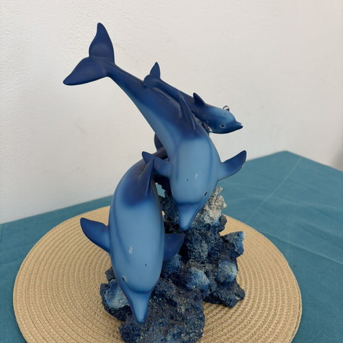 Decorative dolphins refurbished with damage