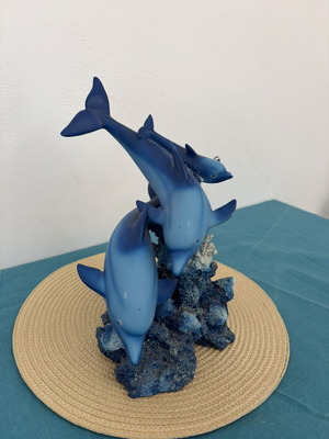 Decorative dolphins refurbished with damage