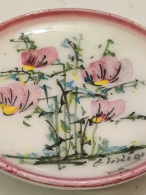 Collectible porcelain miniature with hand-painted design and artist signature