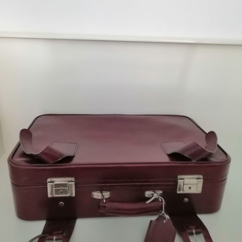 Vintage suitcase used, burgundy color, 1970s with metal clasps
